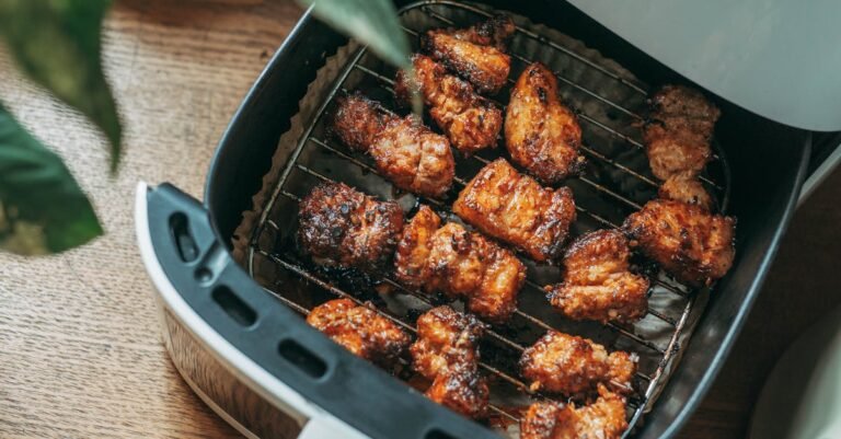 Why Air Fryers Are Becoming a Must-Have Appliance Delicious crispy chicken pieces cooked perfectly in a modern air fryer, ready to serve.