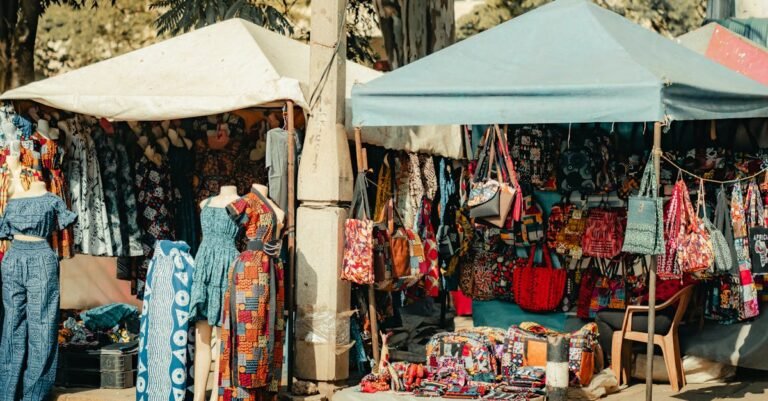 How to Start a Small Reselling Business in Nigeria Colorful textile and fashion stalls in a Nairobi market, showcasing diverse African patterns and designs.